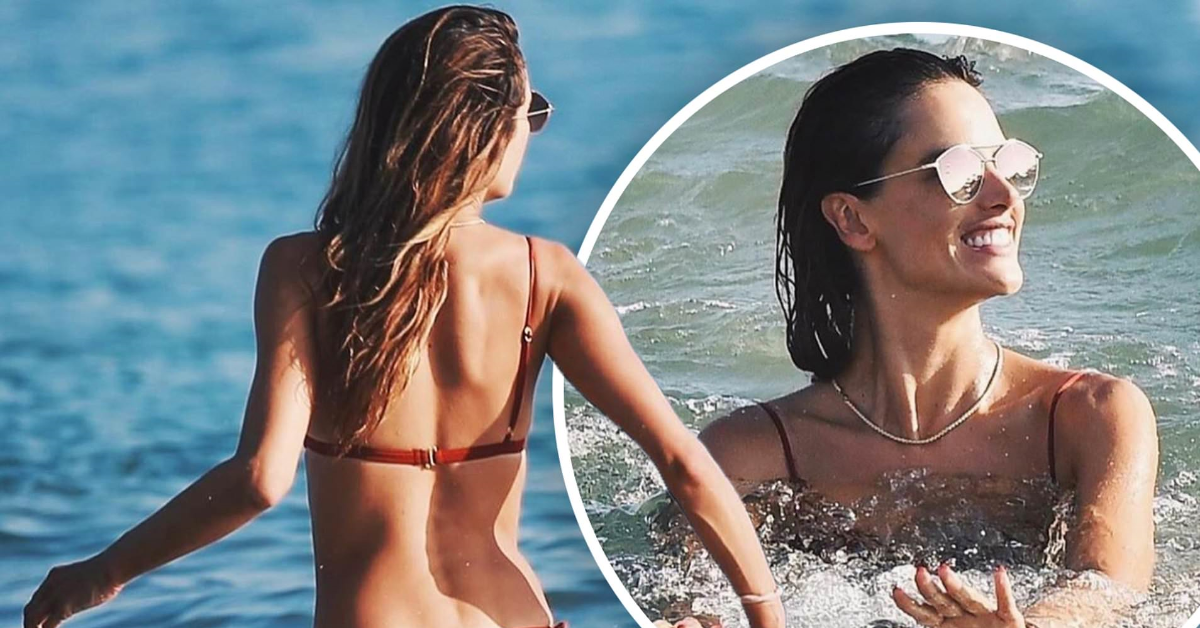Alessandra Ambrosio showcases her impressively sculpted physique while playing beach volleyball with friends in Santa Monica